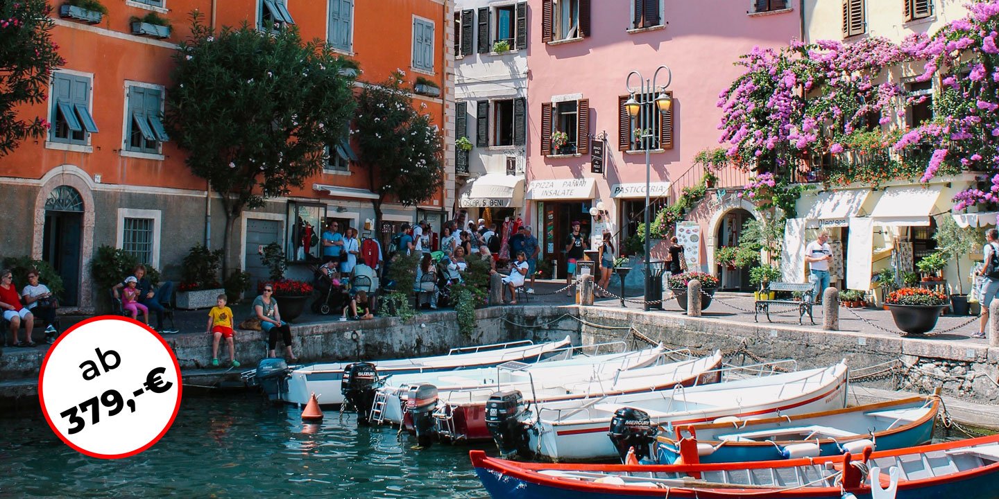 Gardasee with colorful houses and boats