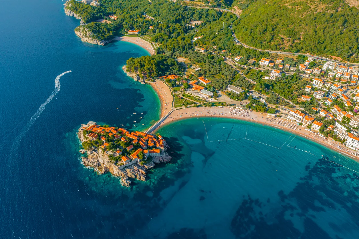 Beautiful view of small island holiday resort surrounded by blue sea on sunny day